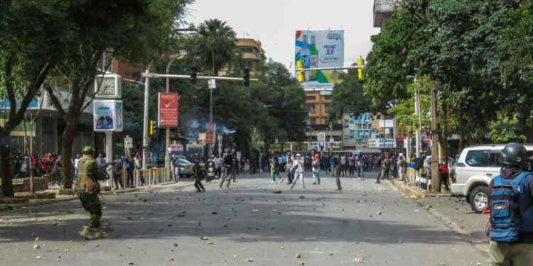 Protesters confront police officers amid civil unrest in Nairobi, Kenya. Photo by Story Zangu.