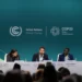 Actor and UNHCR Goodwill Ambassador Theo James (centre) and refugee climate activist Opira Bosco Okot (right) at the launch of the "Refugees for Climate Action" network at COP29 on Thursday.